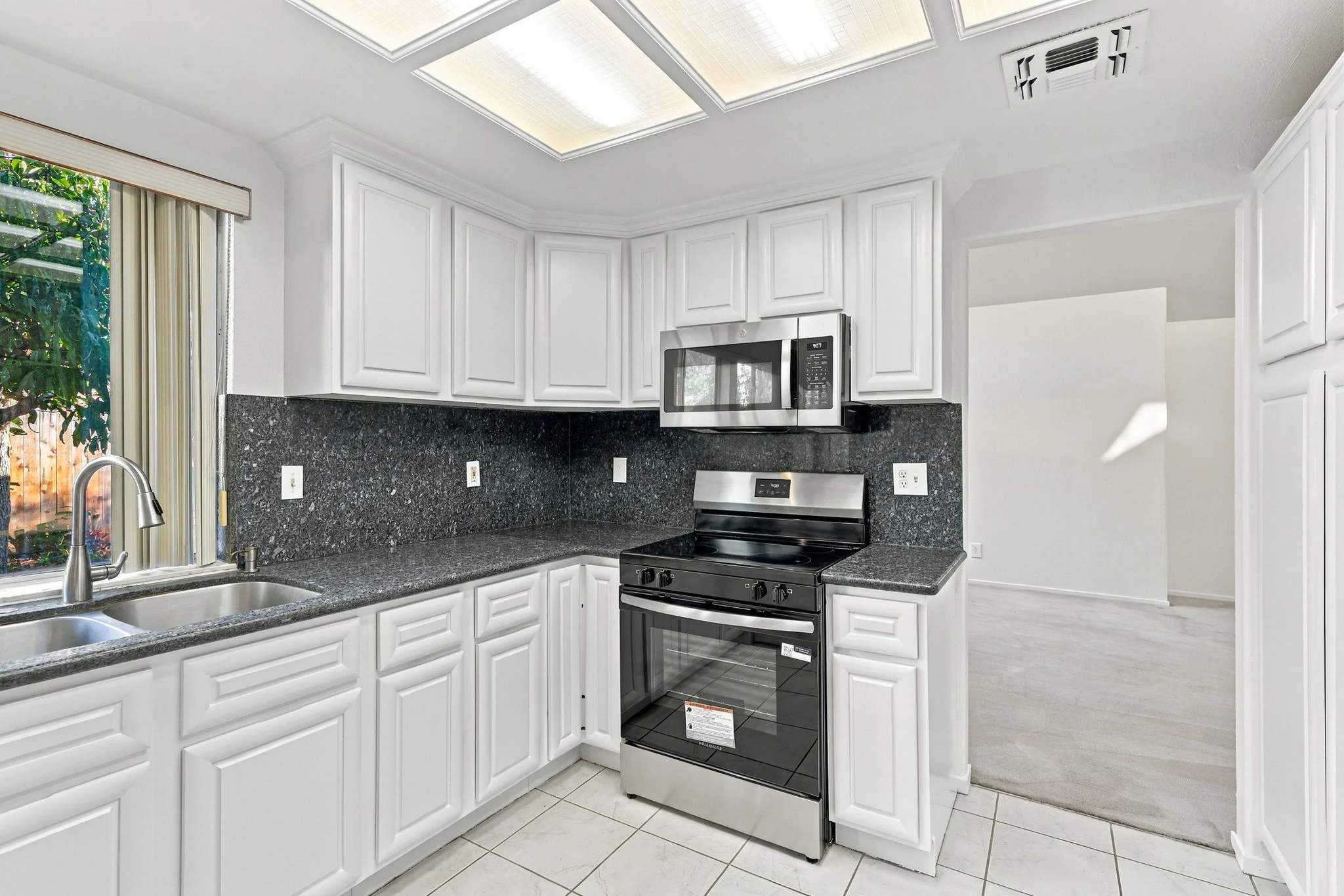 Kitchen with granite countertops and stainless steel appliances