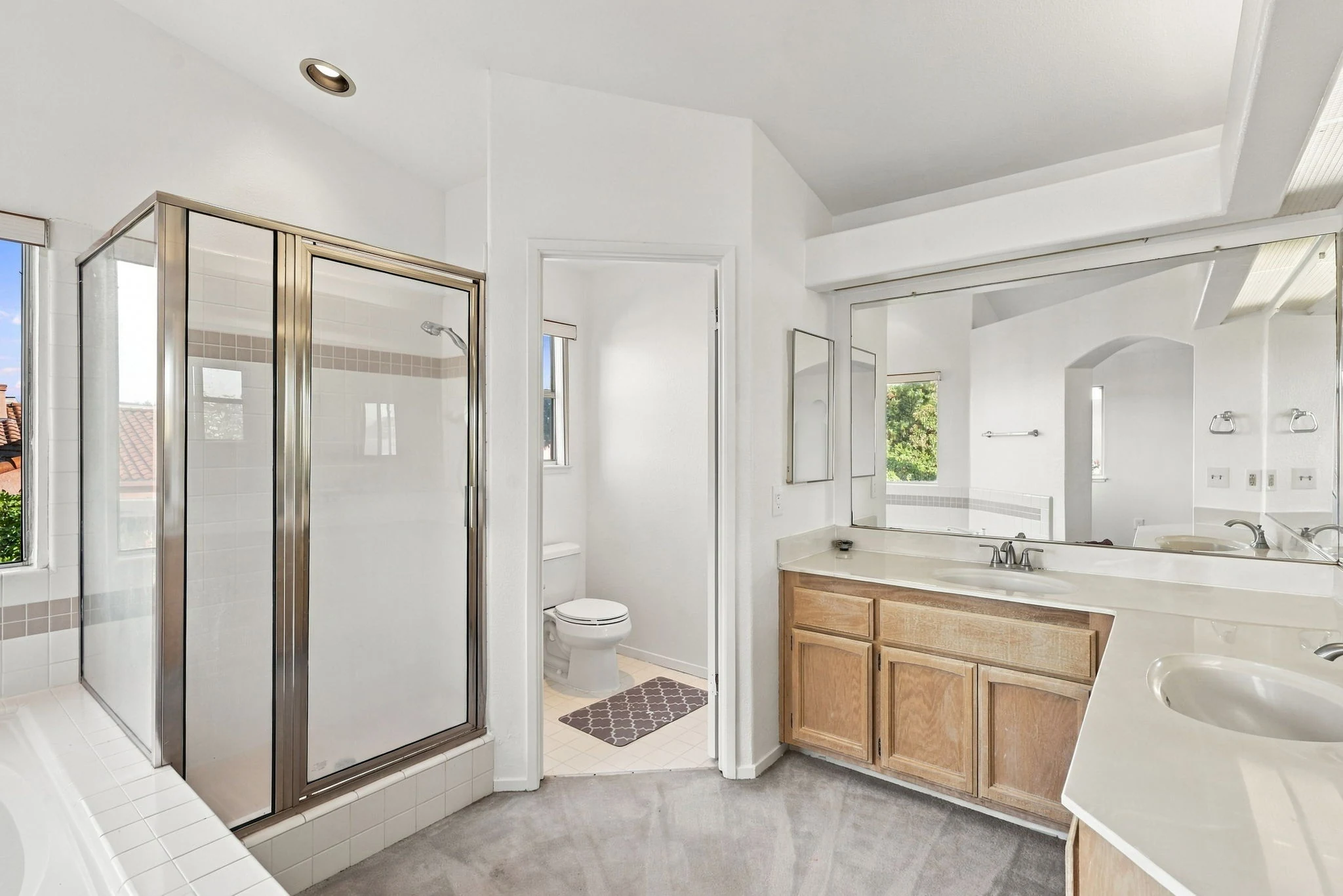 Primary bathroom with separate tub and shower
